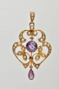 AN EARLY 20TH CENTURY LAVALIER PENDANT, a 9ct yellow gold pendant, decorated with white seed pearls,