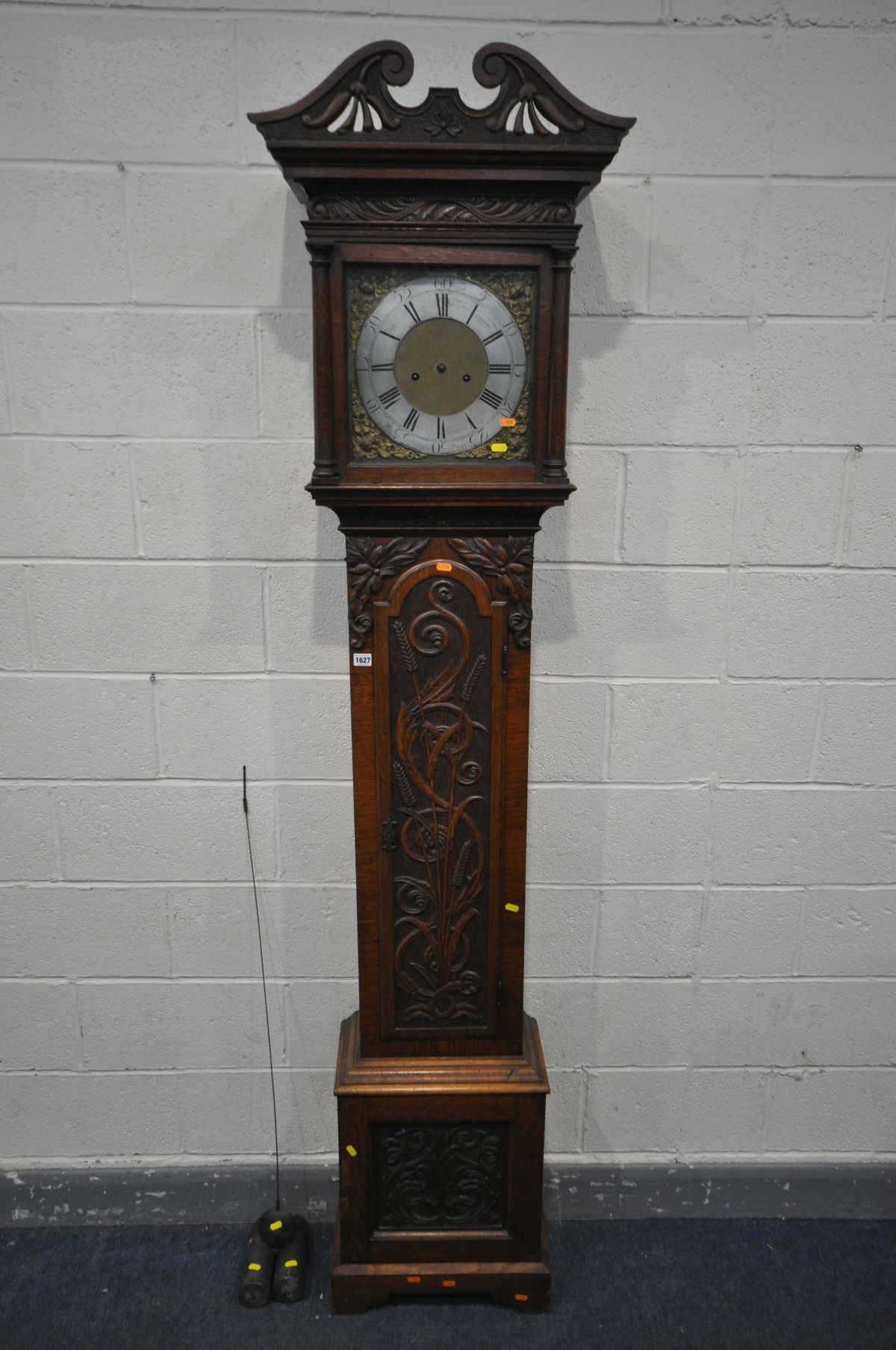 AN OAK EIGHT DAY LONGCASE CLOCK, Whitehurst of Derby, the hood and trunk with carved foliate