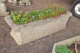A COMPOSITE RECTANGULAR PLANTER with scrolled ends and lattice detailing, width 33cm x length 92cm x