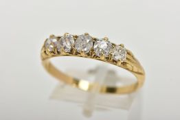 A YELLOW METAL FIVE STONE DIAMOND RING, designed with a row of five old cut diamonds, estimated