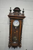 A LATE 19TH CENTURY GUSTAV BECKER WALNUT VIENNA WALL CLOCK, with turned finials, eight day movement,