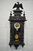 A LATE 19TH CENTURY GERMAN VIENNA WALL CLOCK with a resin eagle pediment, eight day movement and