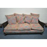 A MAHOGANY FRAMED BERGERE SOFA, with scrolled armrests and with loose cushions, length 196cm (