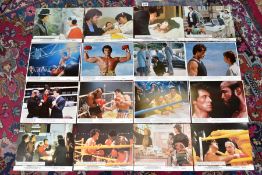 TWO SETS OF EIGHT ROCKY PROMOTIONAL LOBBY CARDS, comprising Rocky II and Rocky III, featuring