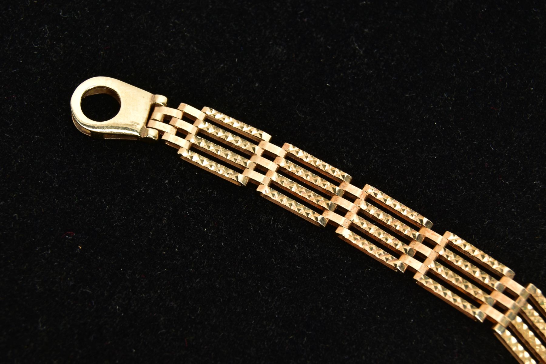 A 9CT GOLD GATE BRACELET, four bar gate bracelet diamond cut pattern to the one side the other a - Image 2 of 4