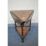 AN EARLY 20TH CENTURY OAK TRIANGULAR OCCASIONAL TABLE with triple drop leaves, open diameter 65cm