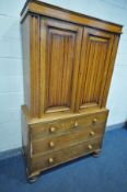 A 19TH CENTURY AND LATER OAK TWO DOOR CUPBOARD ON CHEST, with fitted cornice, two linenfold panelled
