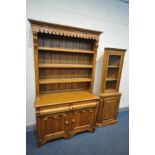 A PINE DRESSER with two drawers, width 121cm x depth 47cm x height 209cm, and a pine glazed corner