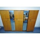 A UNIFLEX FIVE PIECE TEAK BEDROOM SUITE, comprising of a double door wardrobe with a central mirror,