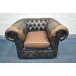 A BROWN LEATHER BUTTONED CHESTERFIELD CLUB ARMCHAIR (condition - some fading to arms, some