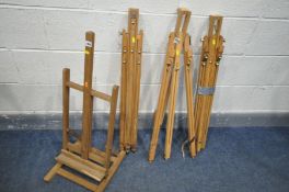 FOUR VARIOUS ARTISTS EASELS, to include three collapsing easels and a surface top easel (4)