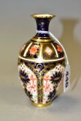 A ROYAL CROWN DERBY IMARI SMALL BALUSTER VASE, decorated in the 1128 pattern, date cypher for