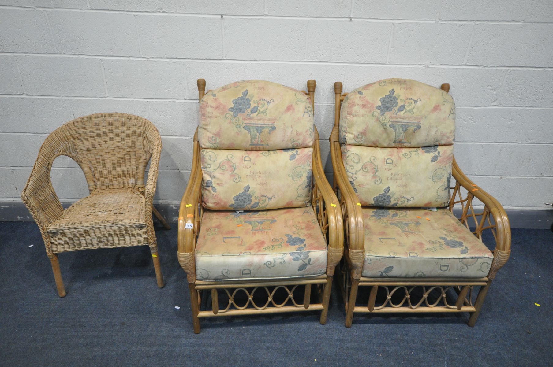 A PAIR OF WICKER ARMCHAIRS, with beige and floral upholstery, and another wicker armchair (Sd to