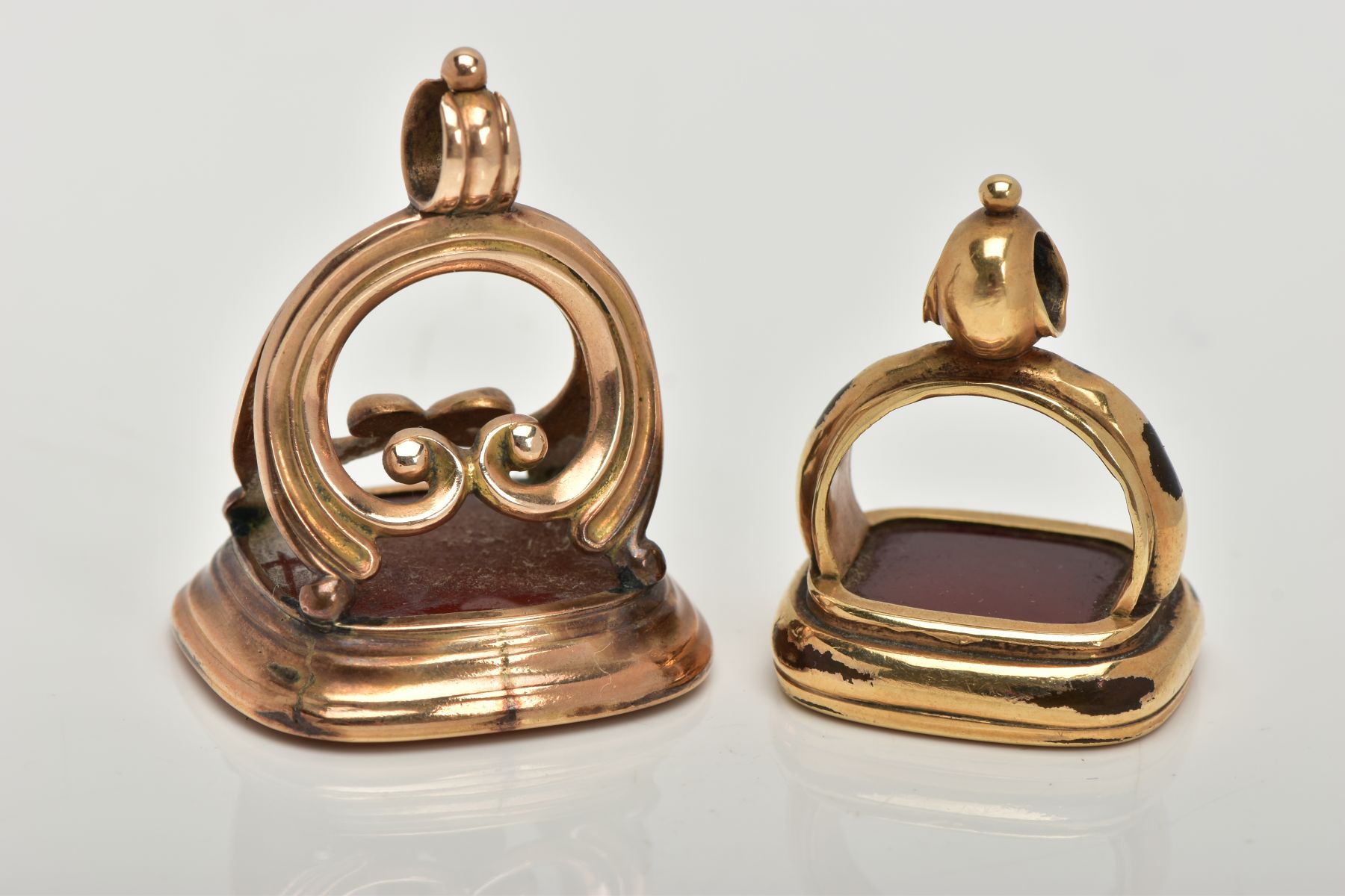 TWO CARNELIAN SEAL FOBS, the first a large rectangular carnelian intaglio detailing an elephant