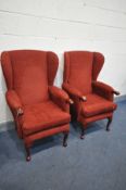 A PAIR OF 'HLS' RED UPHOLSTERED WINGBACK ARMCHAIRS, on cabriole legs