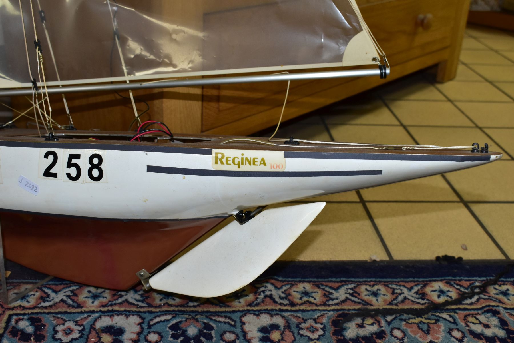 A SCRATCH BUILT MODEL YACHT, at full sail, the deck with rigging and clear sails, motor in hull, - Image 3 of 8