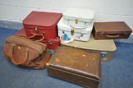 A VARIETY OF VINTAGE LUGGAGE, to include a red suitcase, a similar carry case, two white nesting