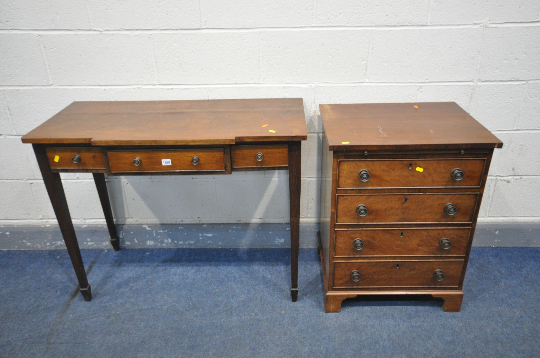 A GEORGIAN STYLE MAHOGANY CHEST OF FOUR LONG DRAWERS, with a brushing slide, on bracket feet,