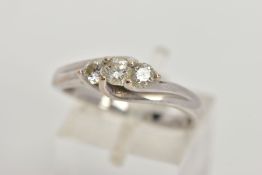 A WHITE METAL DIAMOND RING, three round brilliant cut diamonds prong set in white metal, estimated