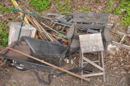 A QUANTITY OF GARDEN TOOLS to include forks, spades, rakes etc, metal wheel barrow, single wooden