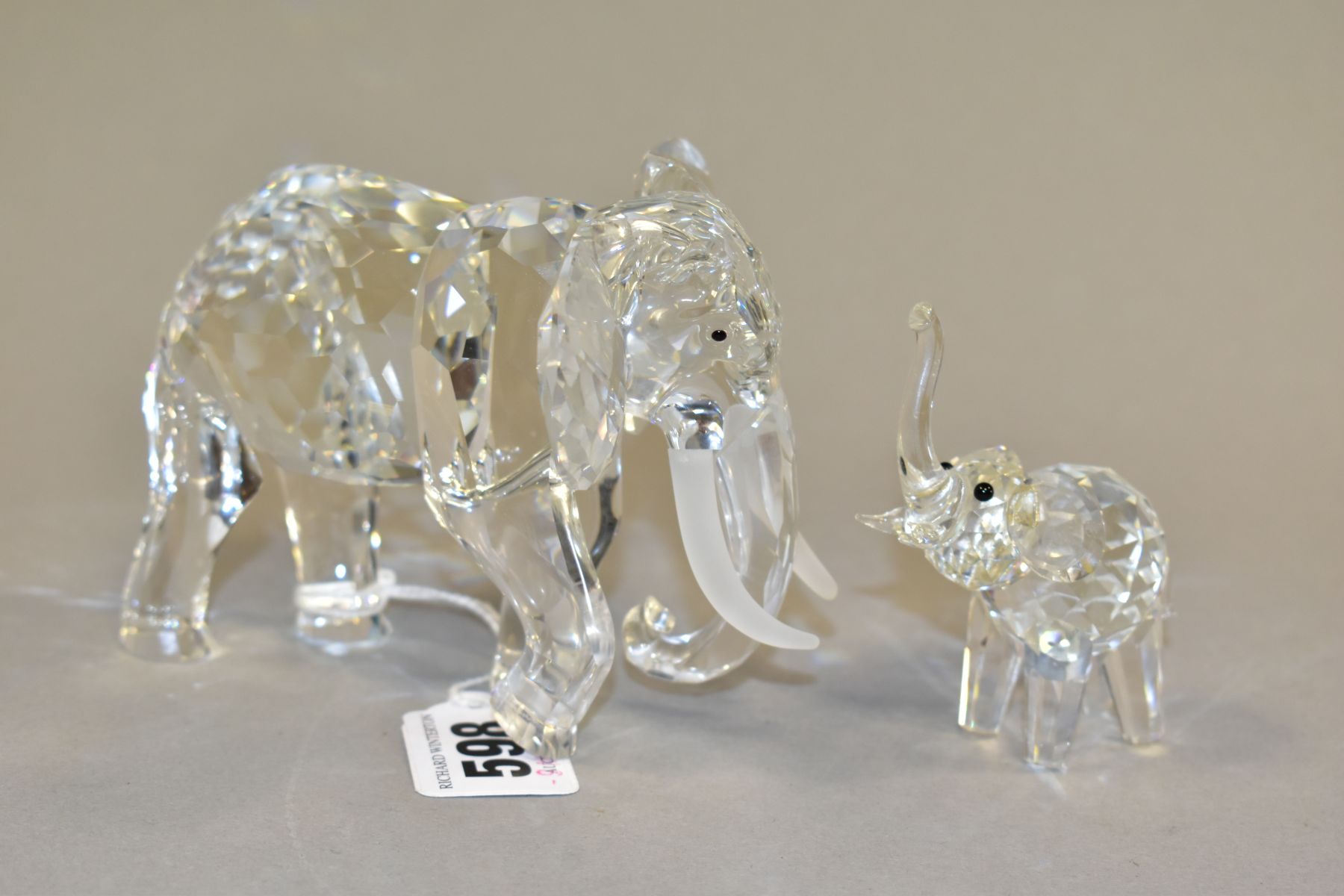 A SWAROVSKI CRYSTAL ELEPHANT AND SIMILAR CRYSTAL FIGURE, comprising an African Elephant Swarovski