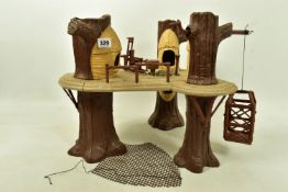 A VINTAGE LFL STAR WARS EWOK VILLAGE PLAYSET 1983, a suspended platform by three trees, with movable