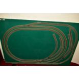 A OO GAUGE MODEL RAILWAY LAYOUT, double oval of track, with a long branch line and four sidings (two
