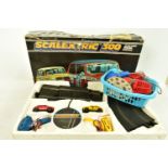 A BOXED SCALEXTRIC 300 ELECTRIC MODEL RACING, box in a poor condition, with the power pack, two mini