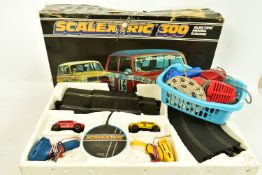 A BOXED SCALEXTRIC 300 ELECTRIC MODEL RACING, box in a poor condition, with the power pack, two mini