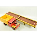 A SCRATCHBUILT WOODEN TIPPER LORRY, red cab, black chassis, yellow body, wooden wheels, steerable