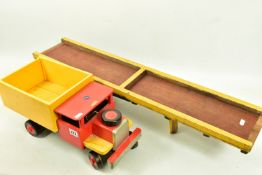 A SCRATCHBUILT WOODEN TIPPER LORRY, red cab, black chassis, yellow body, wooden wheels, steerable