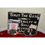 A CAST IRON SHUT THE GATE PENALTY NOTICE, raised white lettering and edge surround on black