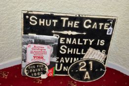 A CAST IRON SHUT THE GATE PENALTY NOTICE, raised white lettering and edge surround on black
