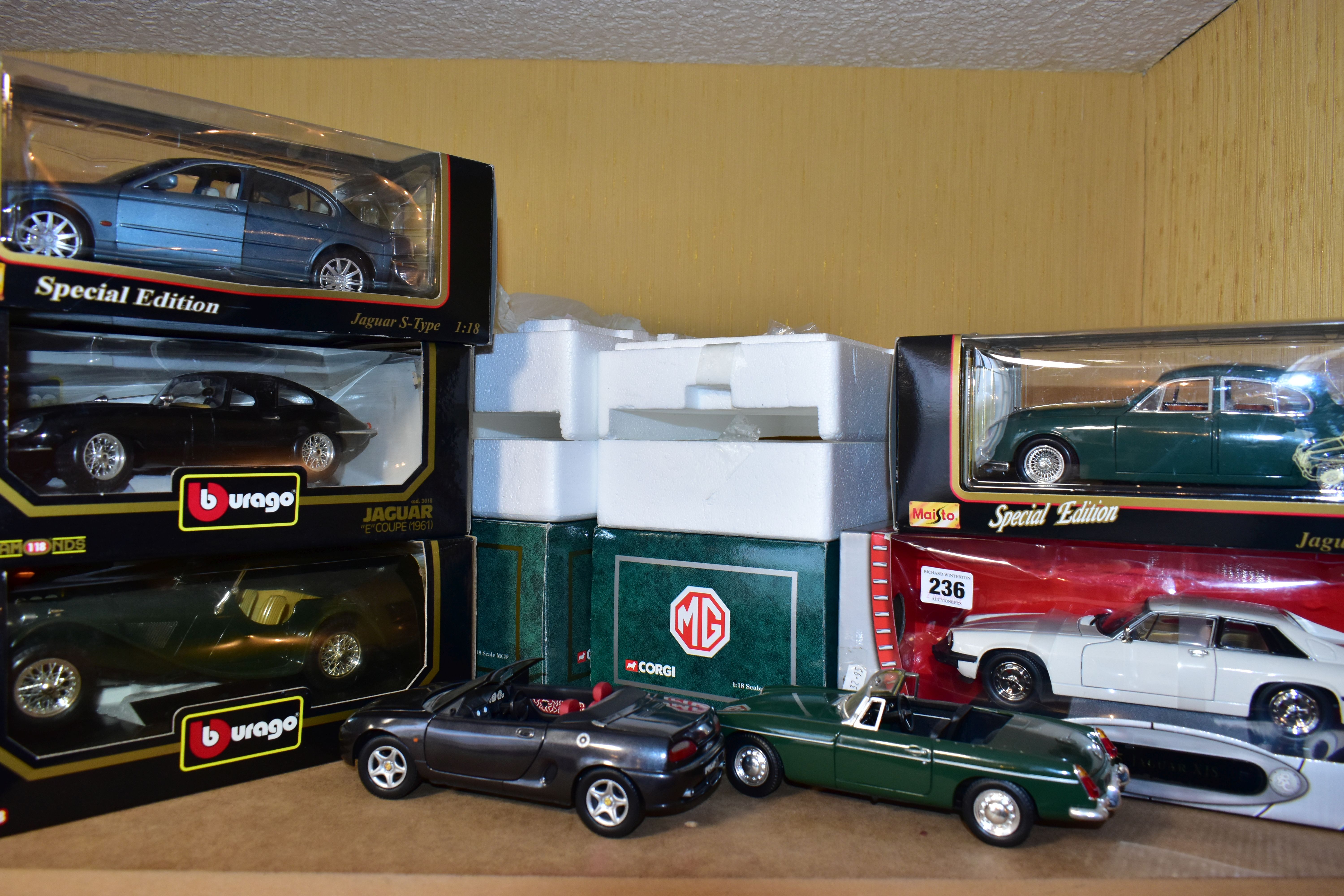 SEVEN BOXED ASSORTED MODERN DIECAST BRITISH CAR MODELS, all 1:18 scale Bburago 1937 Jaguar SS100,