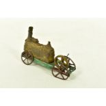 A TINPLATE FLOOR LOCOMOTIVE, no makers marks, gold boiler, green chassis and red wheels, evidence of