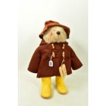 A GABRIELLE DESIGNS PADDINGTON BEAR, version with brown duffel coat and hat and yellow Dunlop
