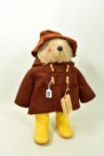 A GABRIELLE DESIGNS PADDINGTON BEAR, version with brown duffel coat and hat and yellow Dunlop