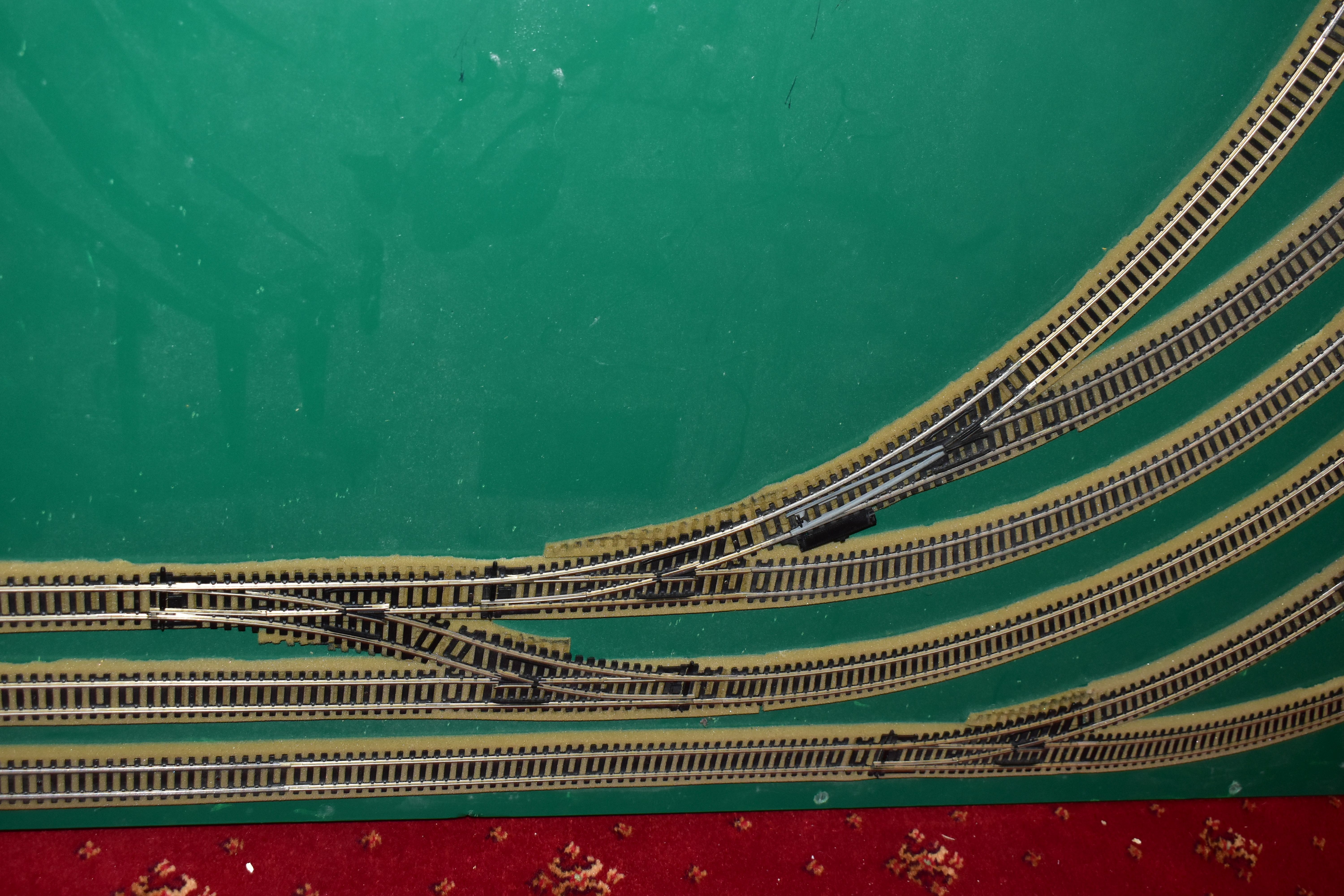A OO GAUGE MODEL RAILWAY LAYOUT, double oval of track, with a long branch line and four sidings (two - Image 5 of 5