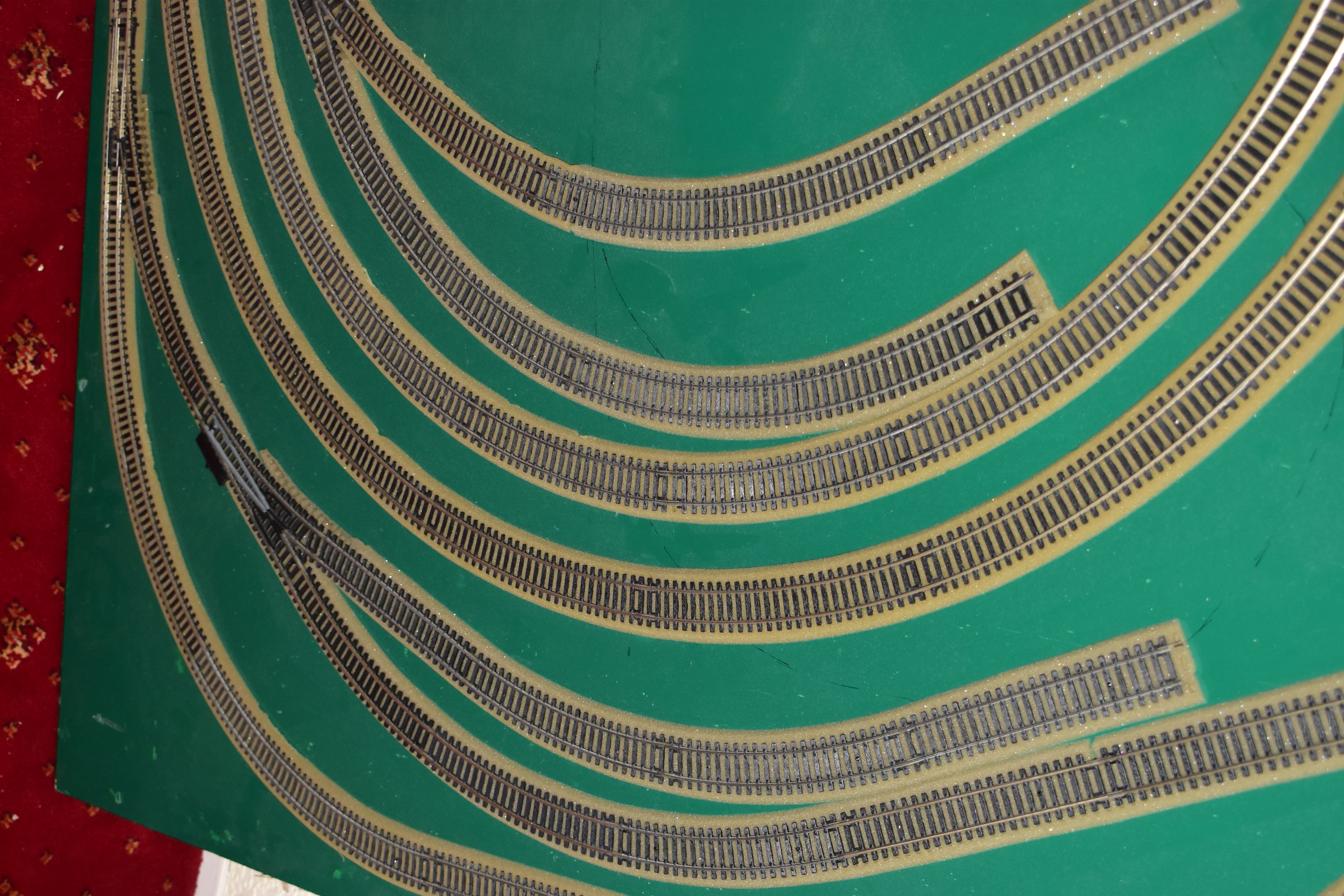 A OO GAUGE MODEL RAILWAY LAYOUT, double oval of track, with a long branch line and four sidings (two - Image 2 of 5