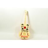 A 1960'S SELCOL BEATLES NEW SOUND PLASTIC GUITAR, cream face decorated with caricatures of the