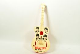 A 1960'S SELCOL BEATLES NEW SOUND PLASTIC GUITAR, cream face decorated with caricatures of the