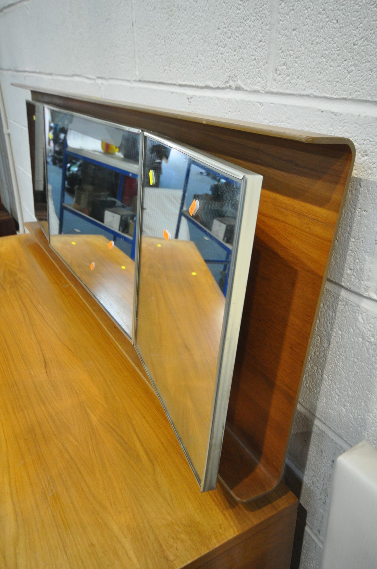 A UNIFLEX FIVE PIECE TEAK DRESSING TABLE, with a plywood back enclosing triple mirrors and seven - Image 3 of 7