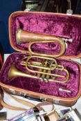 A CASED LAFLEUR BRASS CORNET Serial No 658000 (brass is tarnished, one valve doesn't return and spit