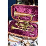 A CASED LAFLEUR BRASS CORNET Serial No 658000 (brass is tarnished, one valve doesn't return and spit