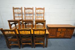 A STAINED HARDWOOD DINING TABLE, length 183cm x depth 108cm x height 77cm, six chairs and a matching