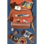 A CAMERA BAG CONTAINING A KODAK RETINETTE FILM CAMERA, a Sun tele converter, Voigtander Rangefinder,