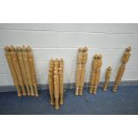 A LARGE QUANTITY OF PINE TURNED SPINDLES, various shapes and sizes, possibly for a bed (24)