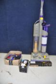 A DYSON DC03 UPRIGHT VACUUM CLEANER , spare brush bar and filter and three attachments for a more