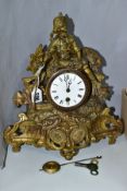 A FRENCH SPELTER MANTLE CLOCK, the case surmounted by a harvester holding a rake, the white dial