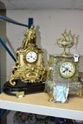 AN EARLY 20TH CENTURY SPECKLED GREY MARBLE AND GILT METAL MANTEL CLOCK, urn surmount, foliate side